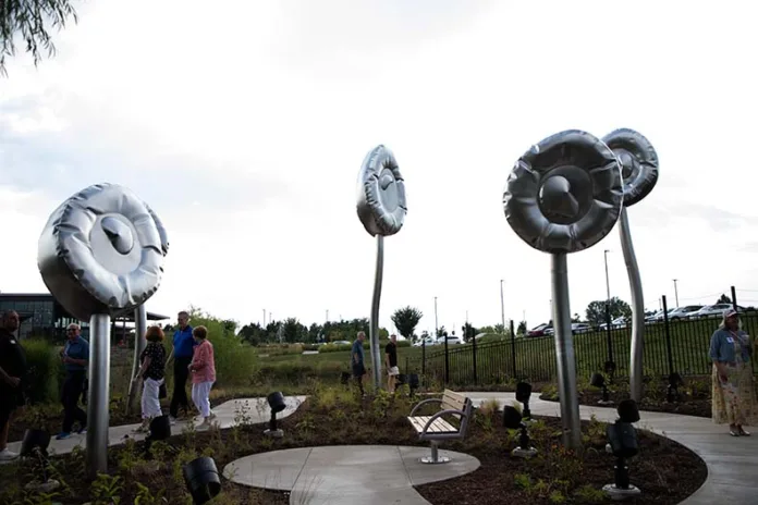 New steel poppy sculpture at Overland Park Arboretum honors late artist’s legacy of kindness